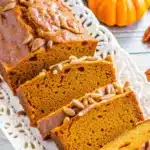 A beautiful loaf of pumpkin bread with brown sugar glaze, perfect for Thanksgiving.