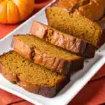 A slice of moist pumpkin bread with a perfect crumb.