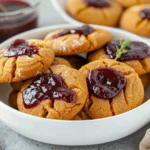 GINGERBREAD THUMBPRINT COOKIES WITH CRANBERRY SAUCE